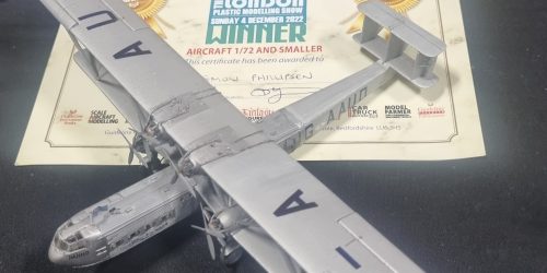 A model aeroplane sat on top of a certificate that reads "the london plastic modelling show: winner"